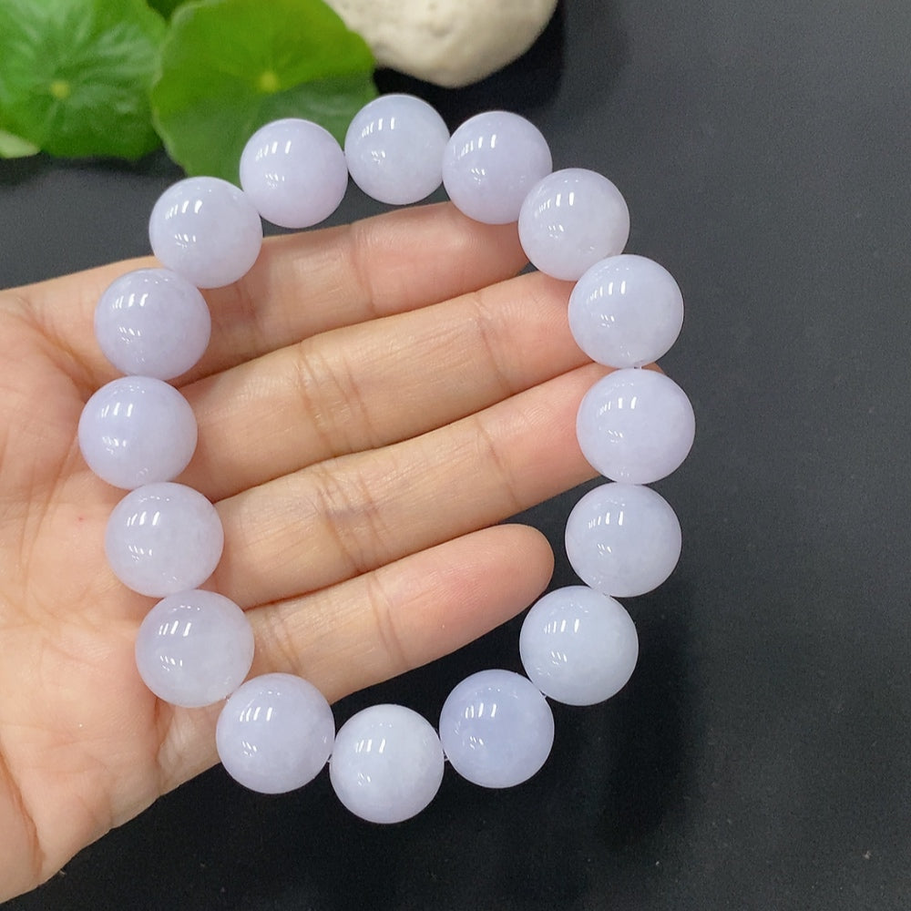 Jadeite bracelet with 12.8mm beads, weighing approximately 55g, featuring smooth green jade beads on a string.