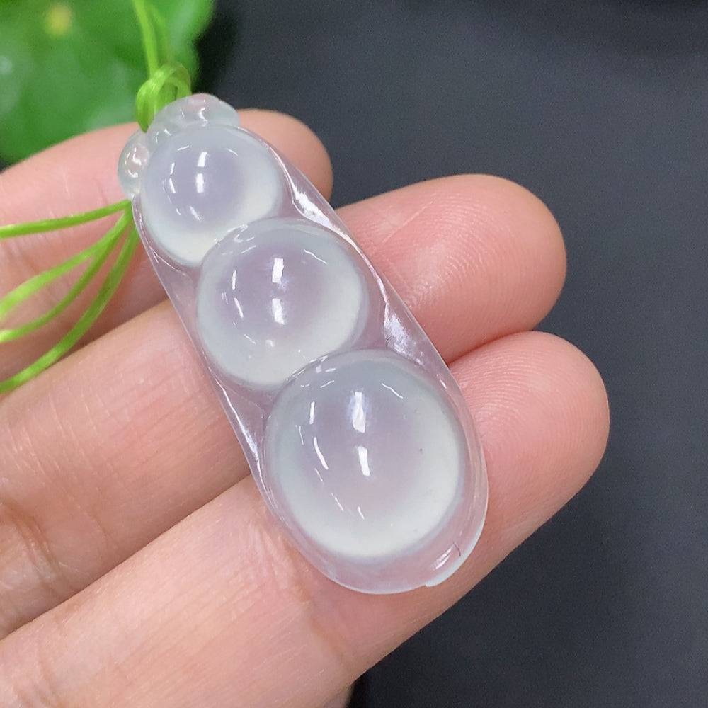 Huiliu Jadeite lucky bean pendant featuring a smooth green jade surface and polished finish, hanging on a delicate cord.