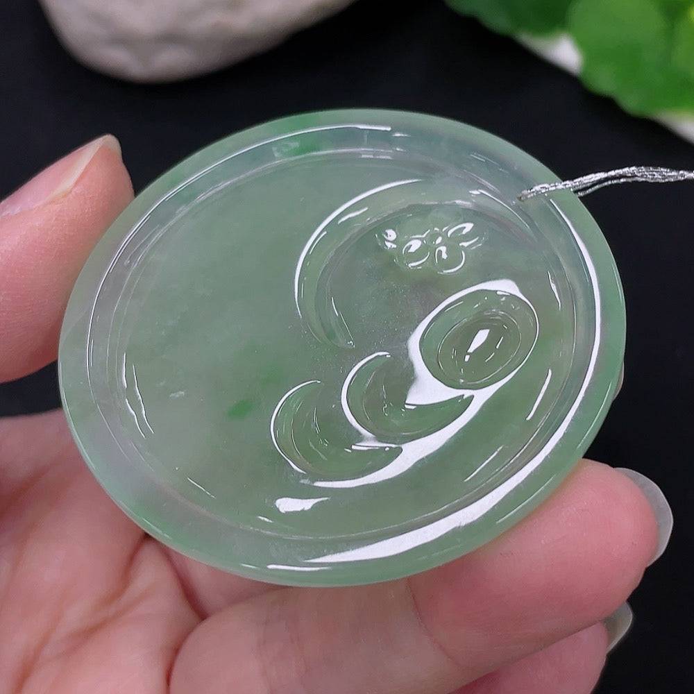Huiliu Jadeite Guanyin pendant featuring intricate carved design, polished jade surface, and Huiliu certification.
