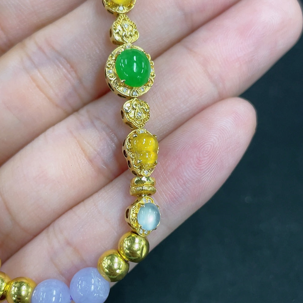 Jadeite bead bracelet with mixed gold components from HKHQ, featuring polished jade beads and gold accents.