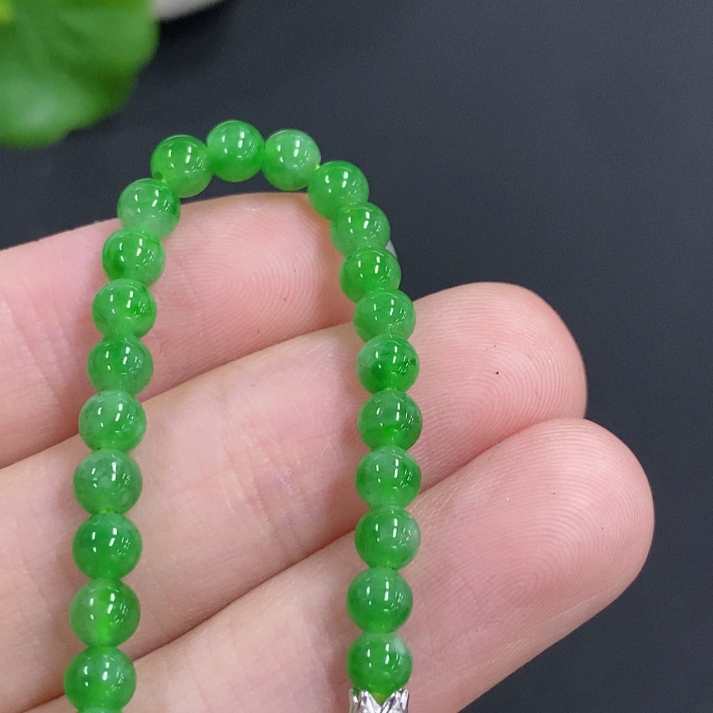 Jadeite single bezel pendant by HKHQ with 18k gold, accented with diamonds, measuring 3.9mm, weight approx. 8.1g including chain