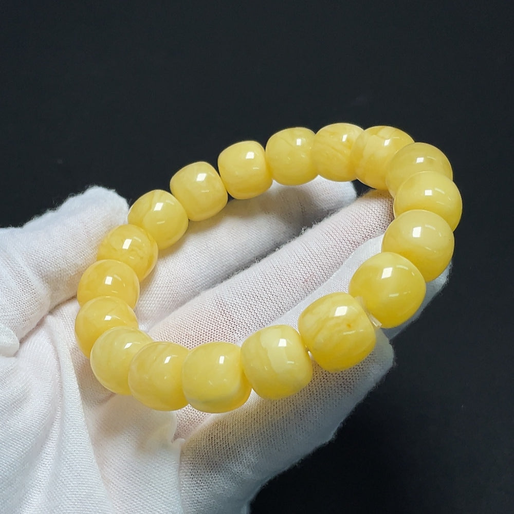 Amber Beeswax Bracelet by HKHQ, 26.18g, featuring warm amber beads and natural beeswax elements on a delicate bracelet.