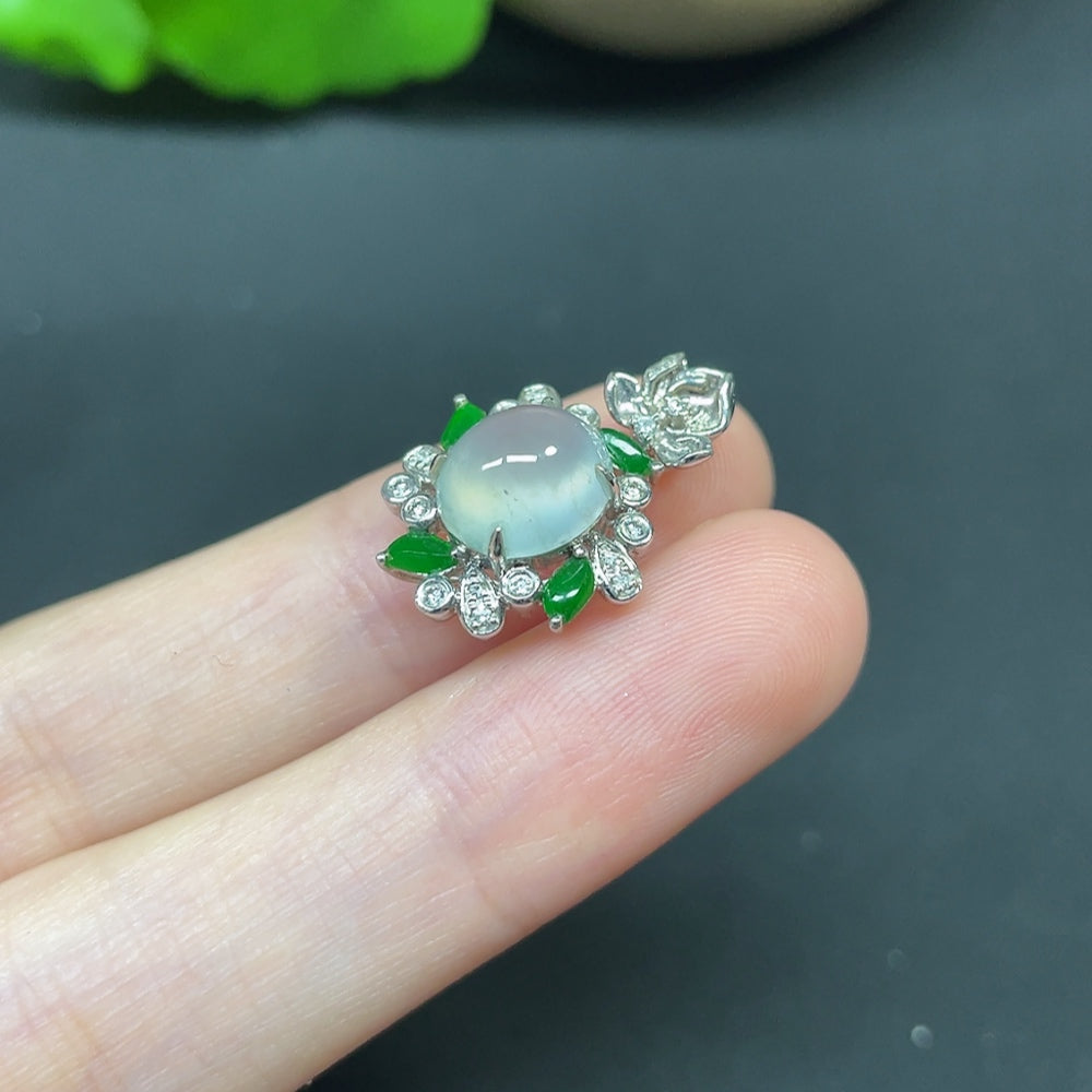 Jadeite cabochon pendant with diamond accents on 18K gold necklace, featuring elegant jewelry design and craftsmanship.