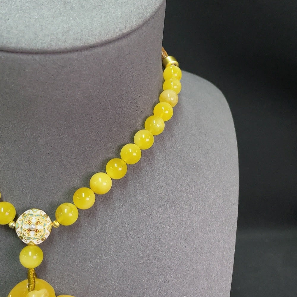 Amber beeswax pendant featuring gemstone stones on a cord, weighs approximately 95.63g, by HKHQ, natural stone appearance.