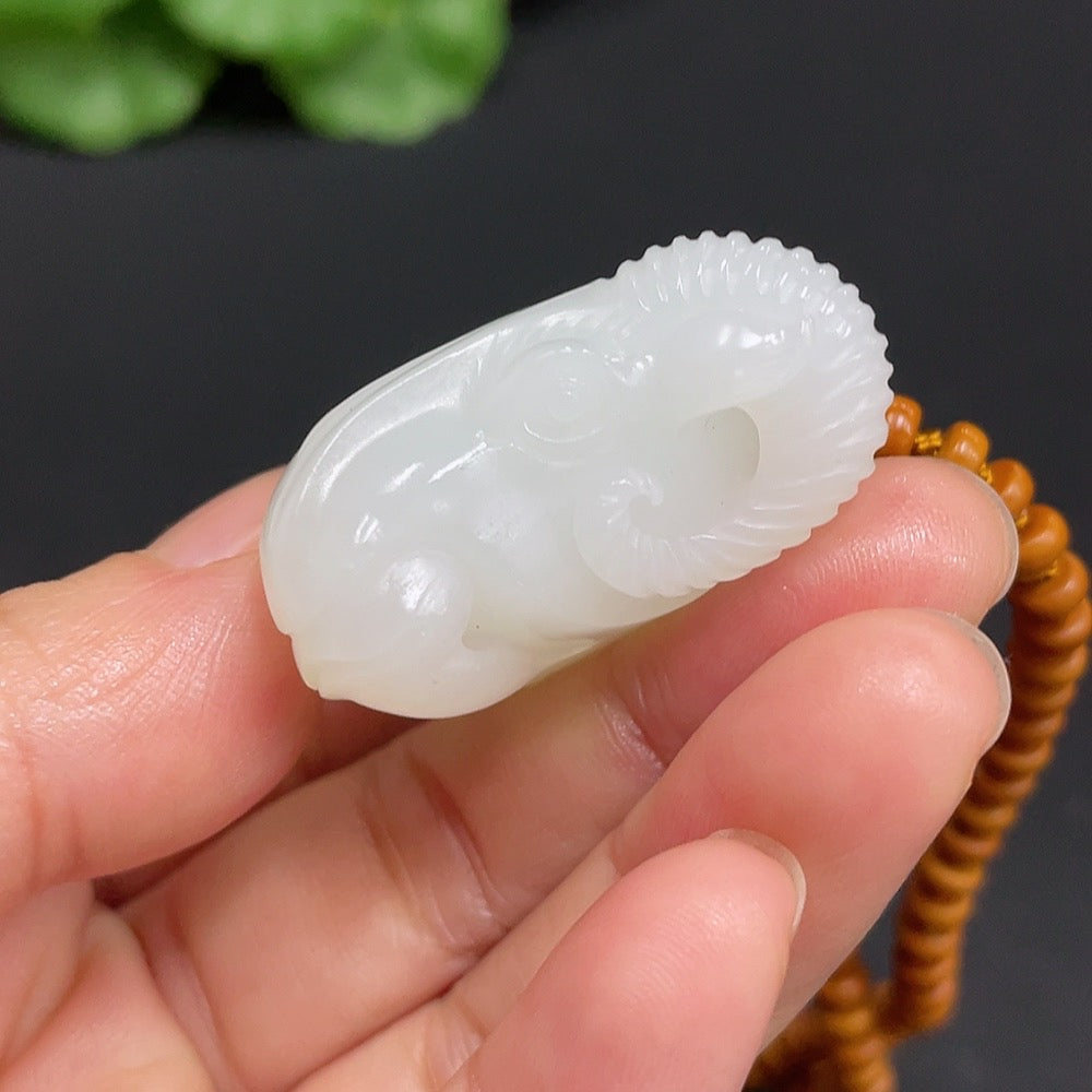 Huiliu HQ Hetian Jade Pendant featuring an auspicious ram design, crafted from high-quality jade with detailed carvings.