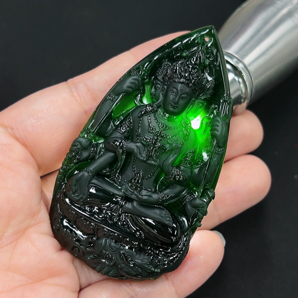 Jadeite Guanyin pendant necklace from HKHQ, featuring a detailed carved figure, weighs approximately 54.3 grams.