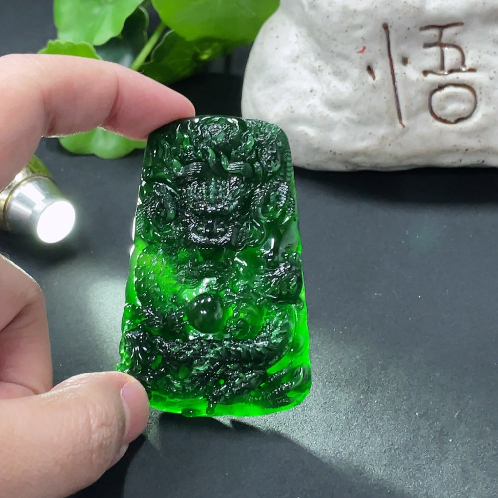 Jadeite dragon pendant weighing approximately 40g, crafted from green jade with intricate dragon details, by HUILIU HQ.