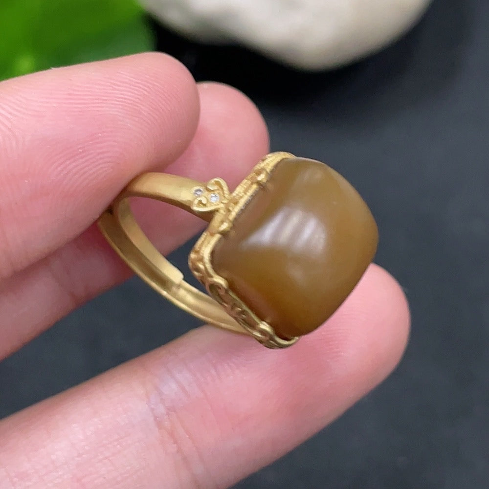 Hetian Jade open-ended ring by HUILIU HQ featuring 18k gold accents and diamond details, showcasing intricate craftsmanship.