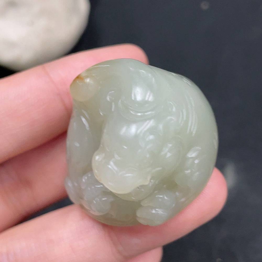 Huiliu certified Hetian jade pendant featuring an auspicious beast design in undetermined skin color, showcasing intricate craftsmanship.