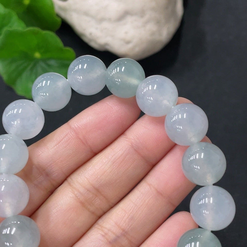 Jadeite bracelet with 12mm beads, weighing approximately 47.72g, crafted by HUILIU HQ, featuring smooth green jade stones.