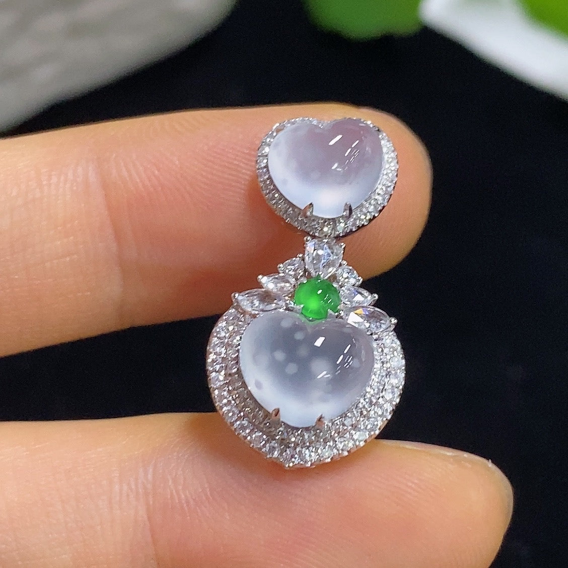 Jadeite heart-shaped pendant with 18K gold and diamond accents, showcasing a smooth, polished jade surface, weight approx. 2.87g