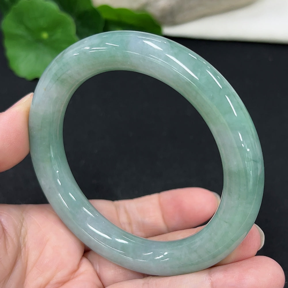 HKHQ jadeite round bangle, size 57.7, 68.6g, showcasing smooth, polished green jadeite bracelet on a white background.