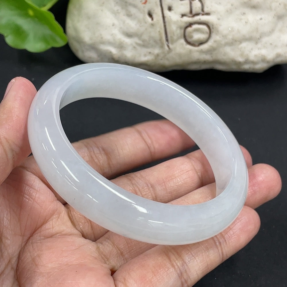 HKHQ jadeite round bangle, 57.5mm size, weighing approx. 58.27g, showcasing smooth, polished green jadeite bracelet.