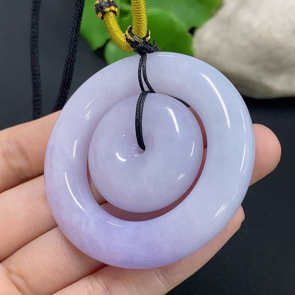 Jadeite mother-and-child toggle pendant with detailed carvings, weighing approximately 55.29g, crafted by HKHQ.