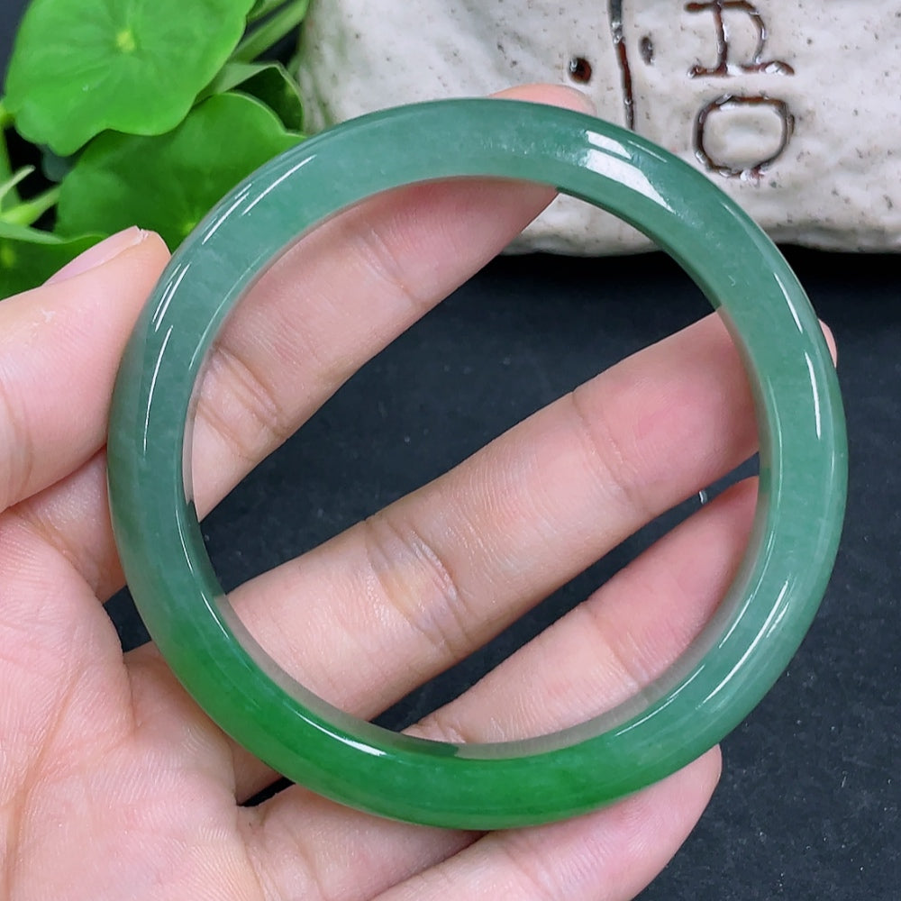 HKHQ jadeite round bangle in size 54, weighing 38.5g, showcasing smooth, glossy green jadeite bracelet on a neutral background.