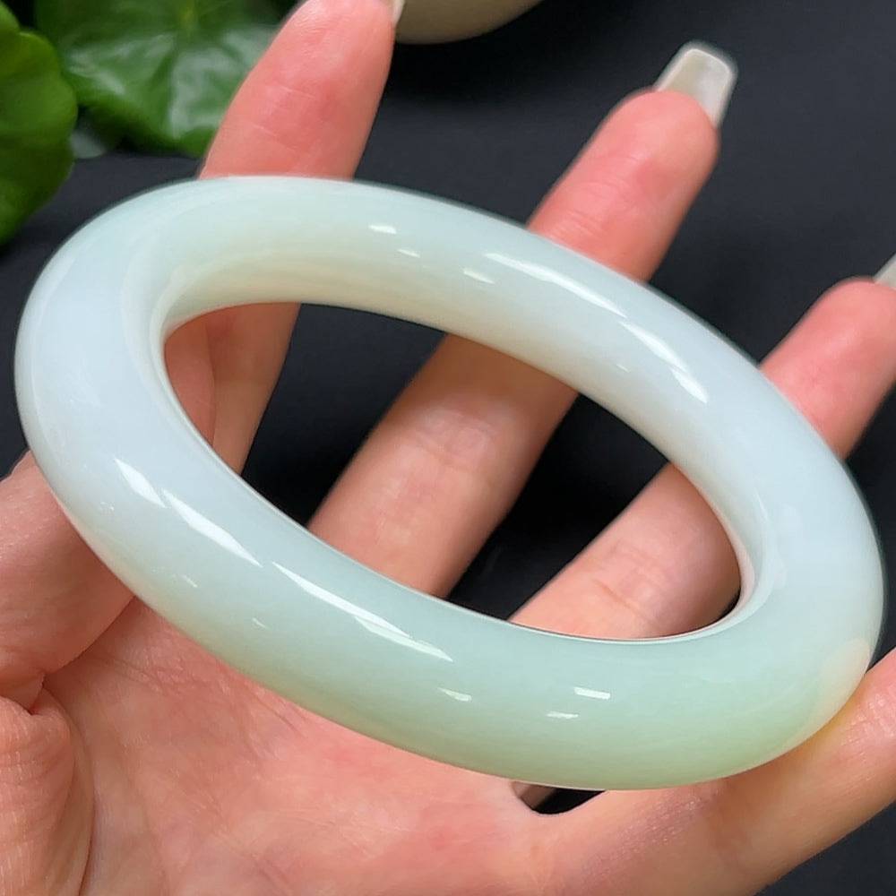 Hetian Jade round bangle in size 61.5, weighing 96.73g, showcasing smooth, polished jade craftsmanship by HKHQ.