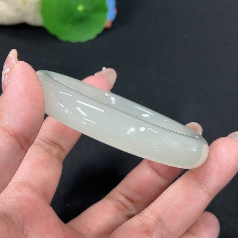 Huiliu certified Hetian jade round bracelet featuring smooth, polished jade beads on a delicate string.