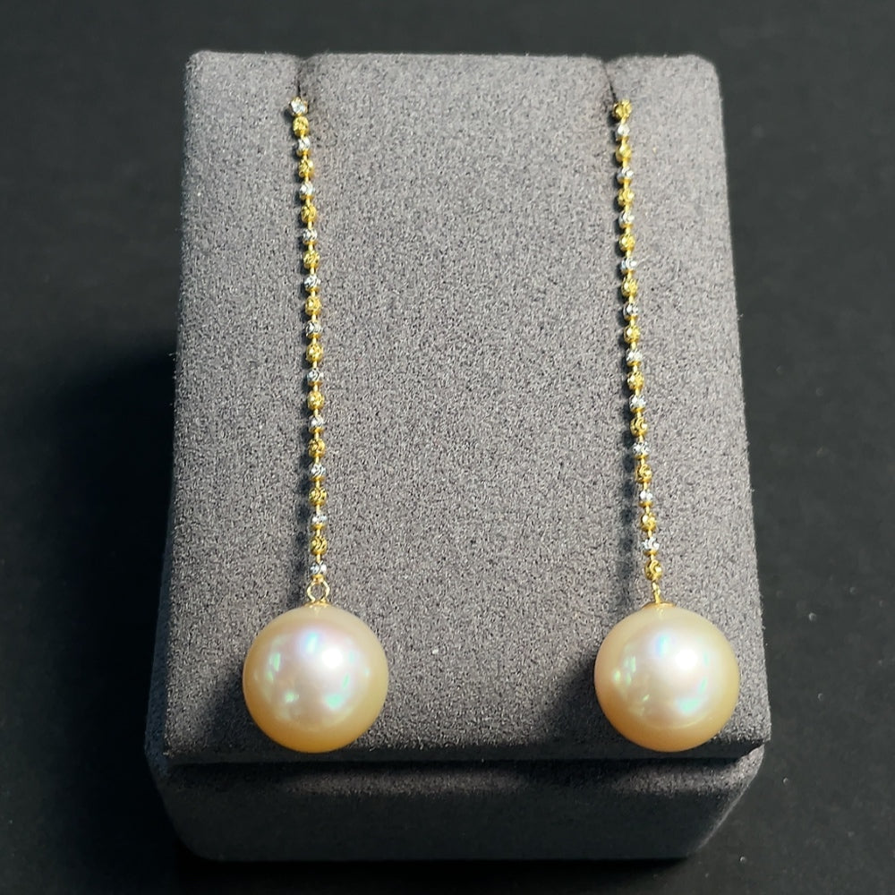 HKHQ seawater pearl earrings with 18K gold string, 12.4mm pearls, total weight 6.59g, natural undetected color.