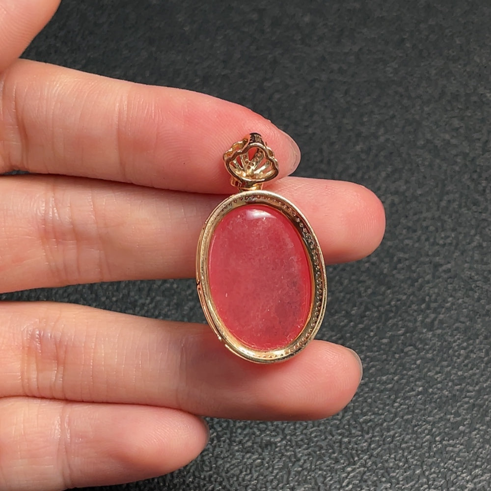 Huiliu Rhodochrosite gemstone pendant with diamond accents, showcasing vibrant pink stone and sparkling diamond details.