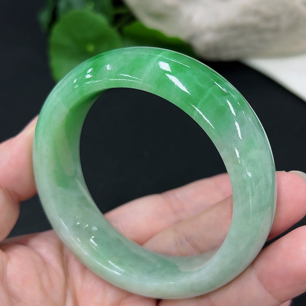 Jadeite round bangle with size 53.6 and weight 82.02g from HKHQ, showcasing smooth, polished jade surface.