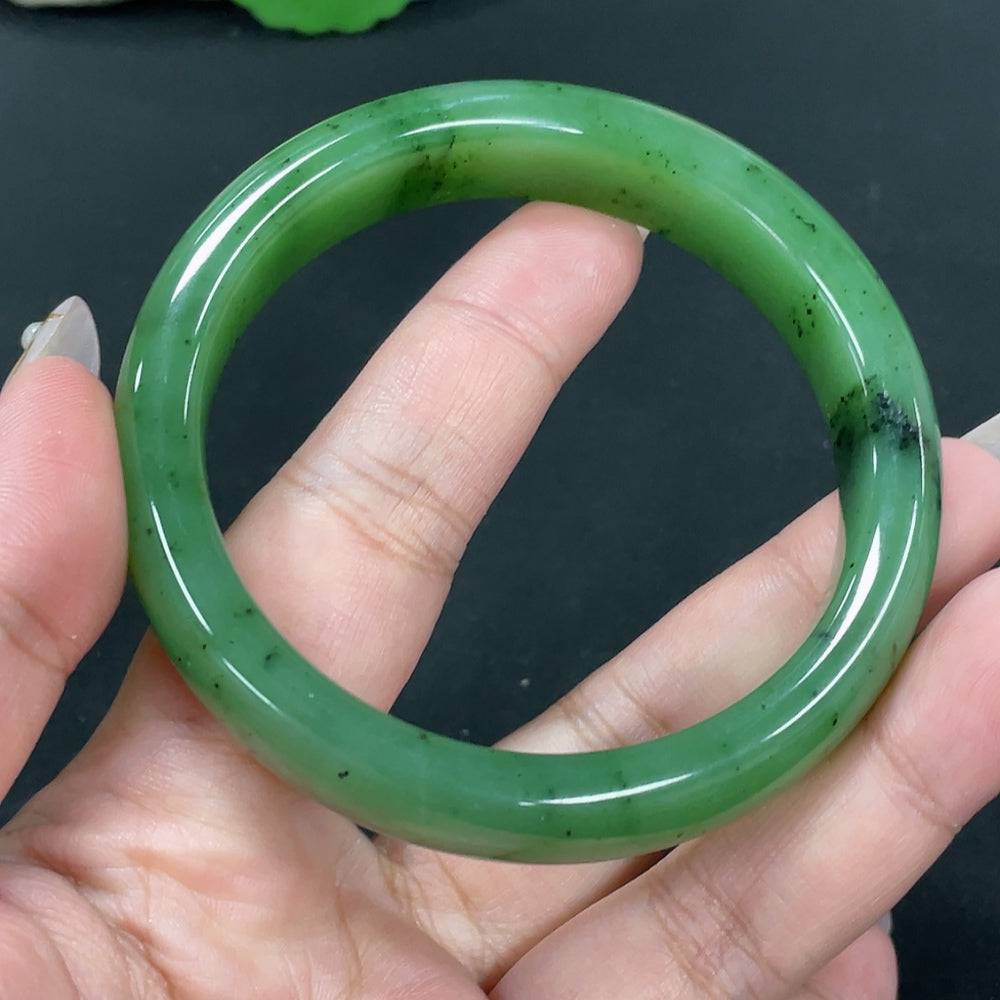 Huiliu certified Hetian jade round bracelet showcasing smooth, polished jade beads on a delicate elastic cord.