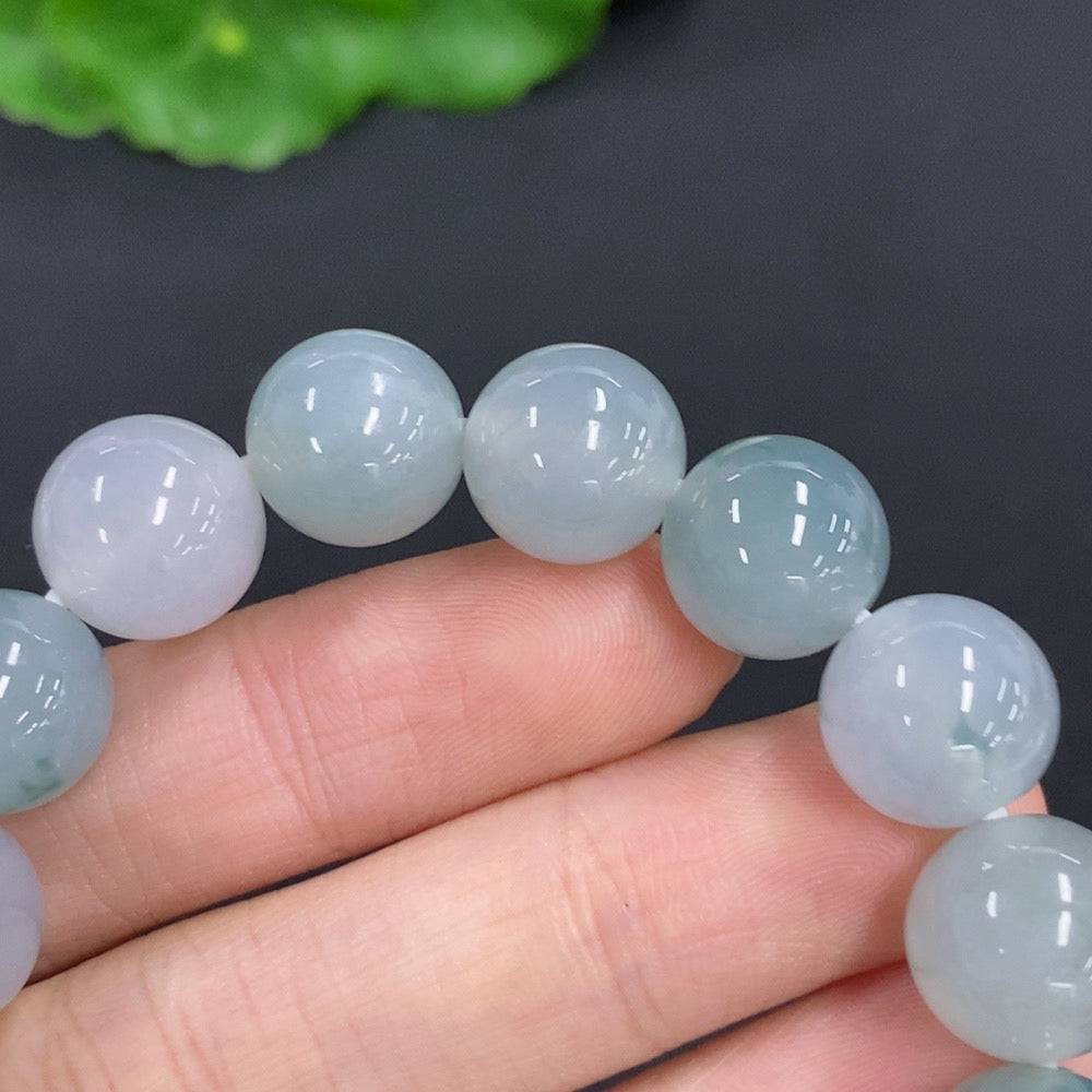 HUILIU HQ jadeite bracelet weighing 44.7g with 11.7mm jade beads, showcasing smooth, polished green jade stones.