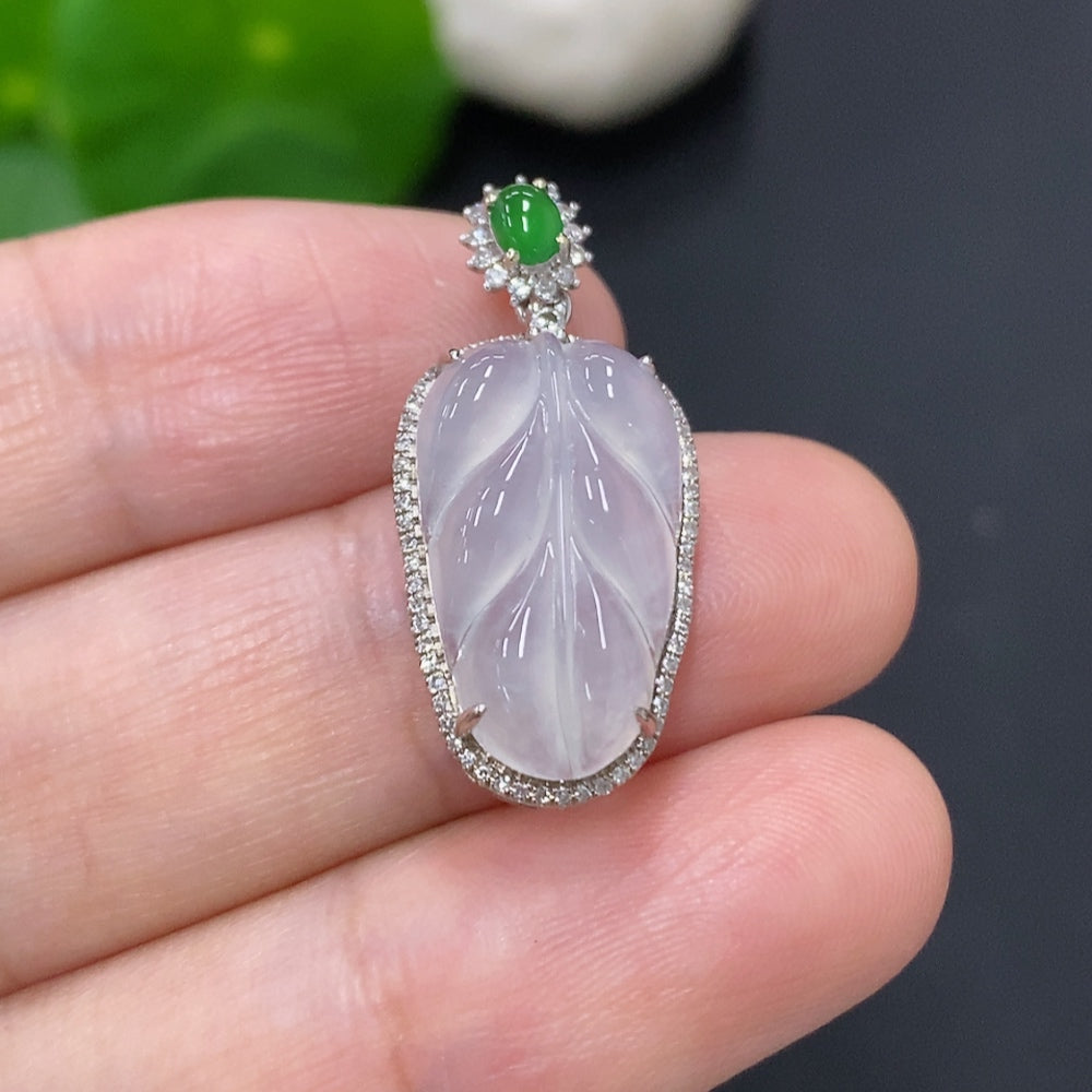 Jadeite leaf pendant with diamond accents in 18K gold, weighing approximately 2.5 grams, by HKHQ.