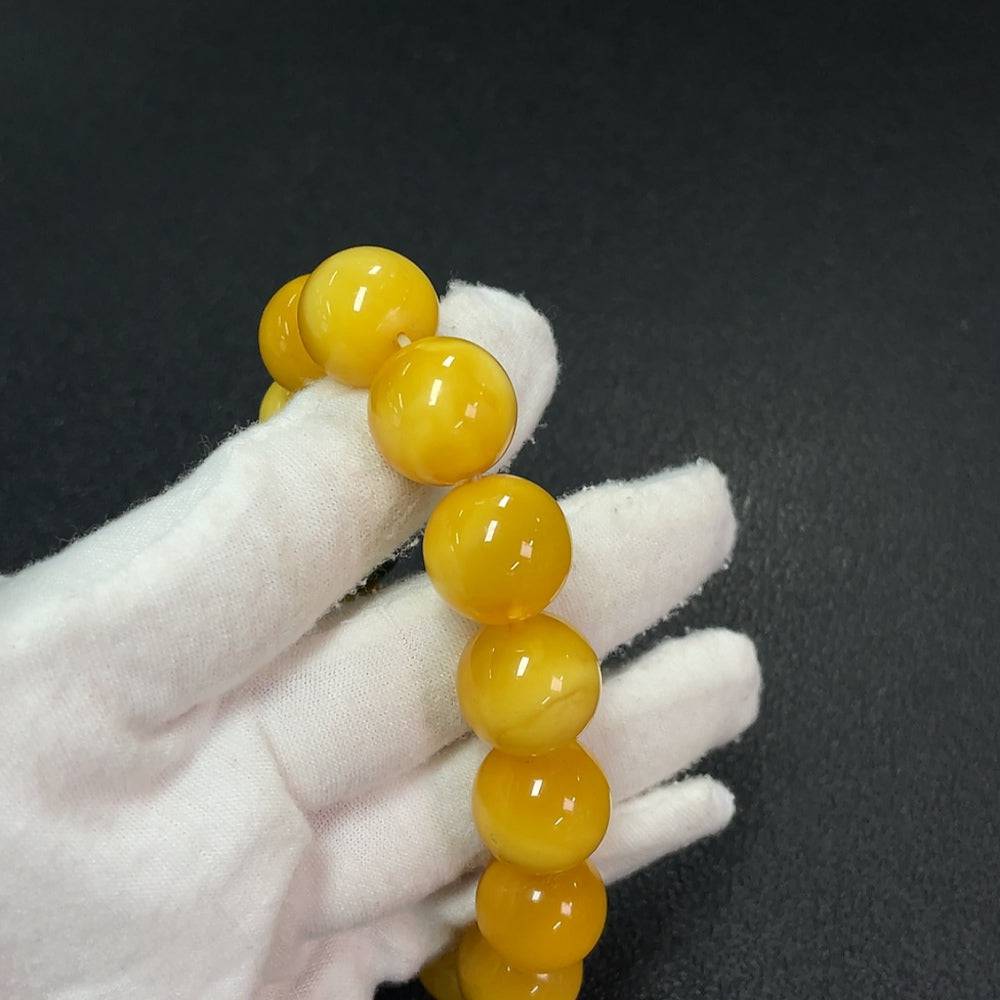 Amber beeswax bracelet with Hetian jade beads, about 15mm, partially repaired, by HUILIU HQ, showcasing natural amber and jade gemstones.