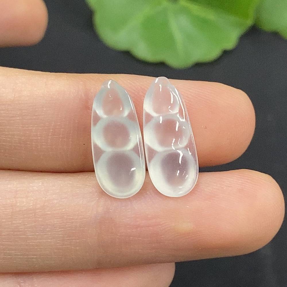 Jadeite auspicious bean inlay piece by HUILIU HQ, detailed green jade with intricate craftsmanship on a white background.