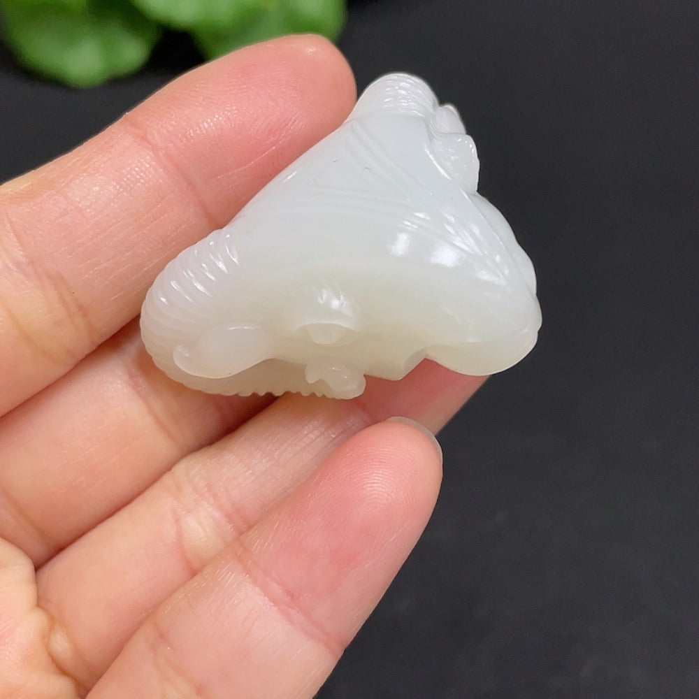 Huiliu HQ Hetian Jade pendant featuring an auspicious ram design, crafted from polished green jade with intricate carvings.