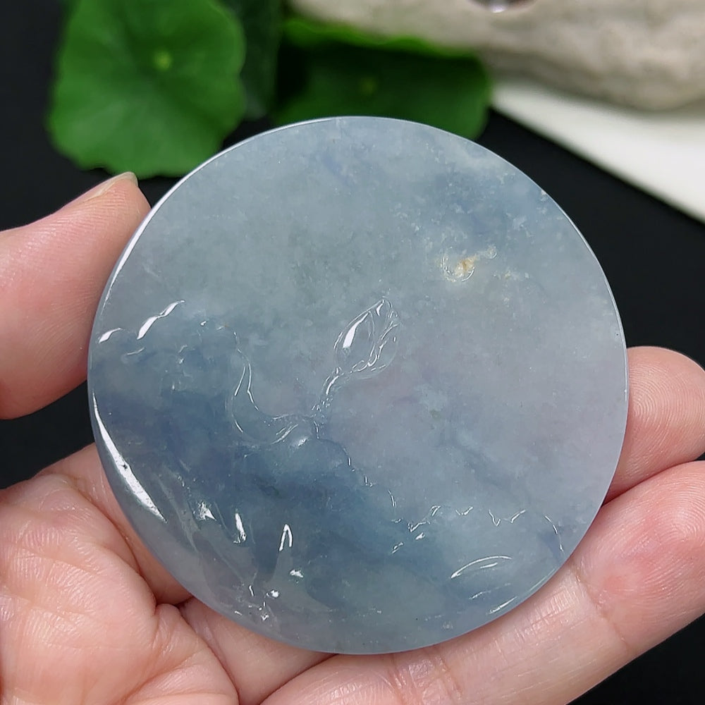 Jadeite lotus pendant from HKHQ, crafted from jade with intricate lotus design, weighing approximately 39.4 grams.