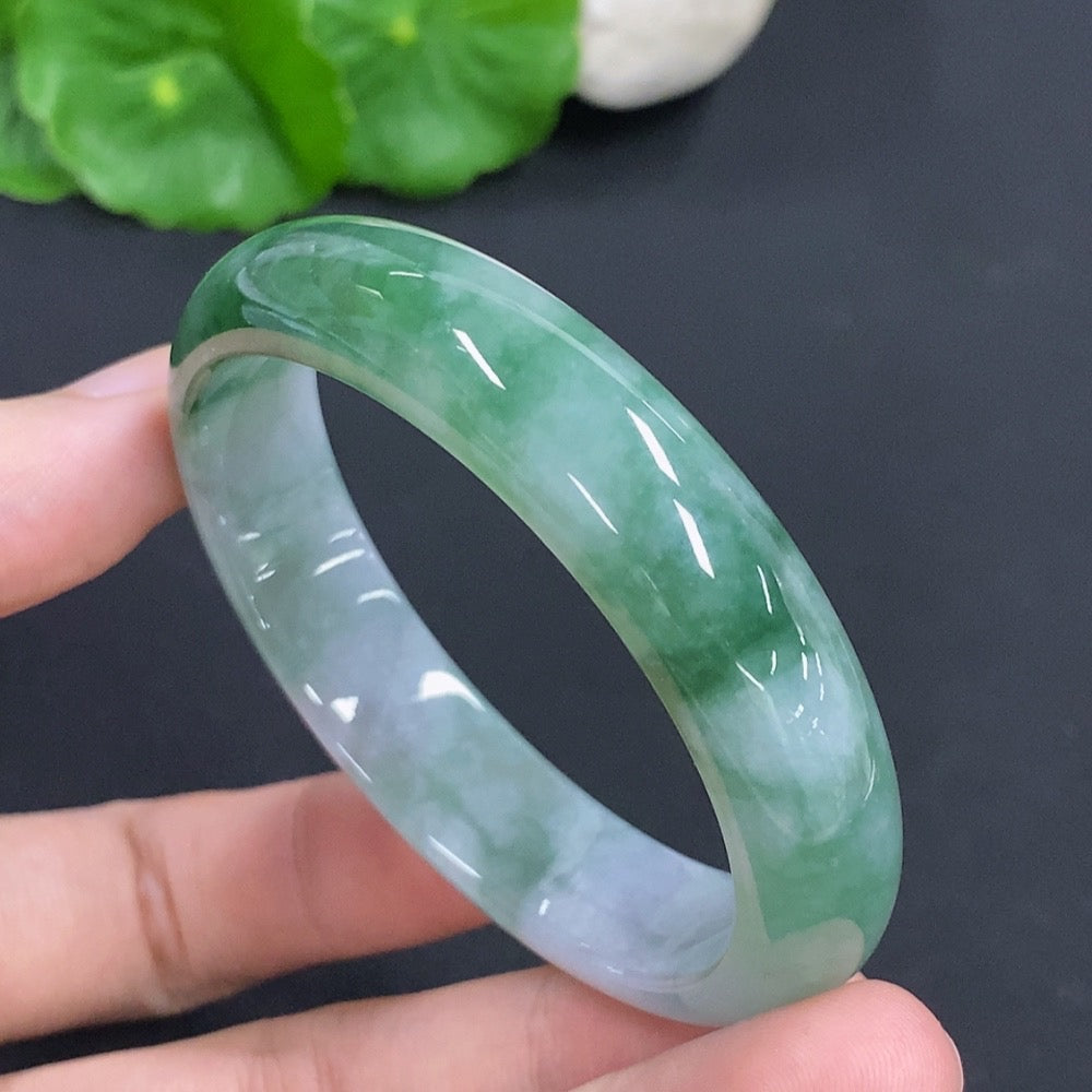 HKHQ jadeite oval bangle in size 53, weighing 38.1g, featuring smooth polished jadeite with an elegant oval shape.