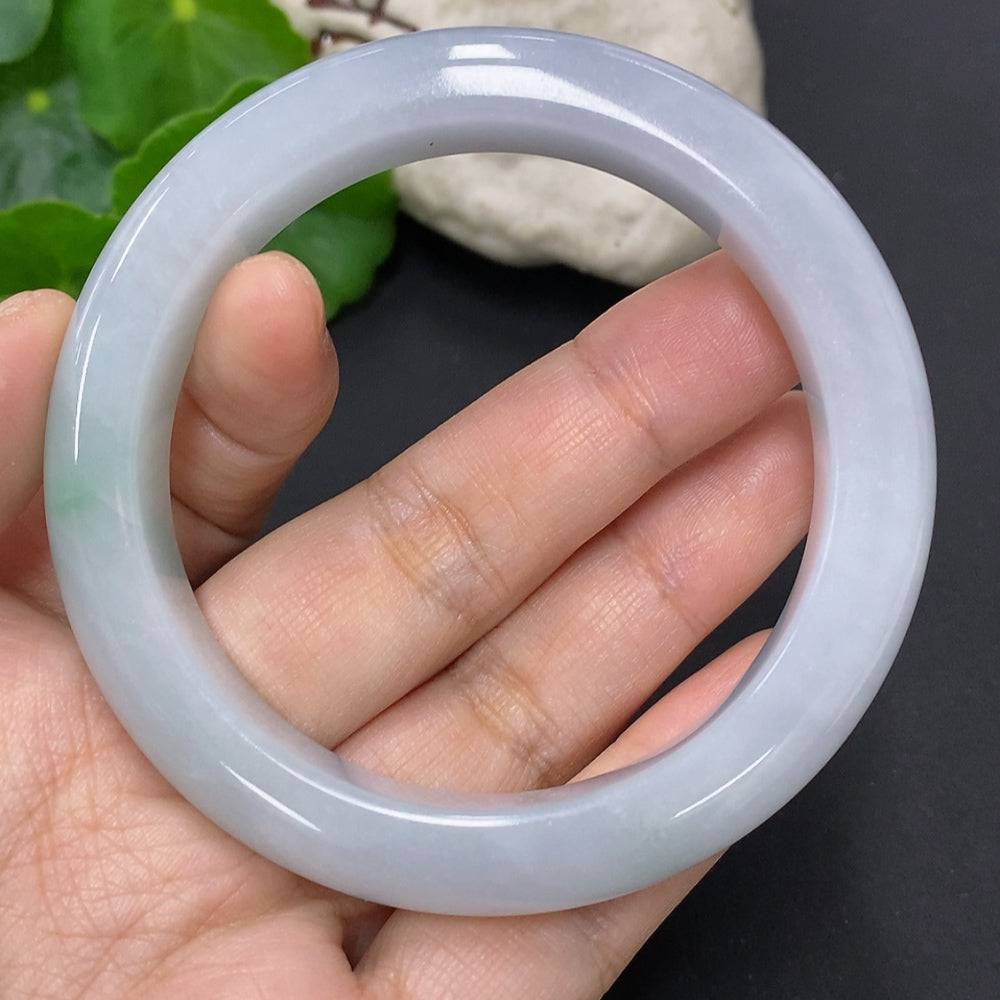 HUILIU HQ jadeite round bangle in size 56, weighing approximately 63.1g, showcasing smooth, polished jade jewelry.