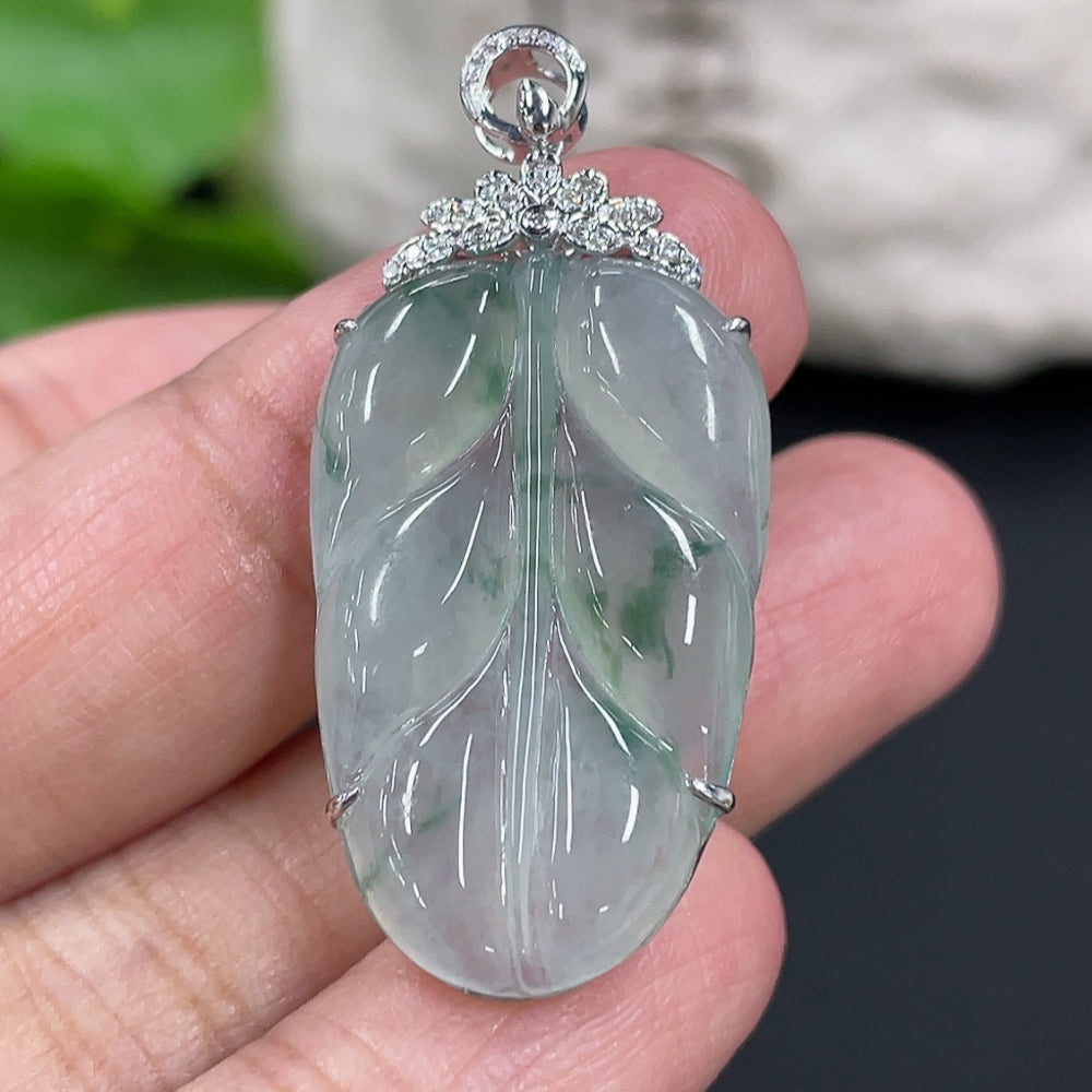 HUILIU HQ jadeite leaf pendant in 18K gold with diamond accents, showcasing intricate leaf design and elegant craftsmanship.