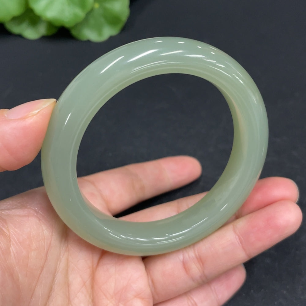 Huiliu Certified Hetian Jade round bracelet featuring smooth, polished jade beads in natural green hue, crafted by HUILIU HQ.