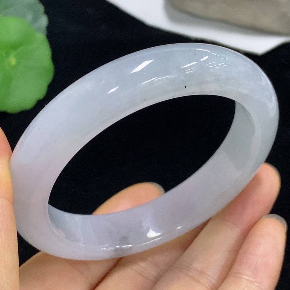 Huiliu Jadeite round bracelet featuring smooth, polished green jade beads, certified by Huiliu, on a soft fabric background.