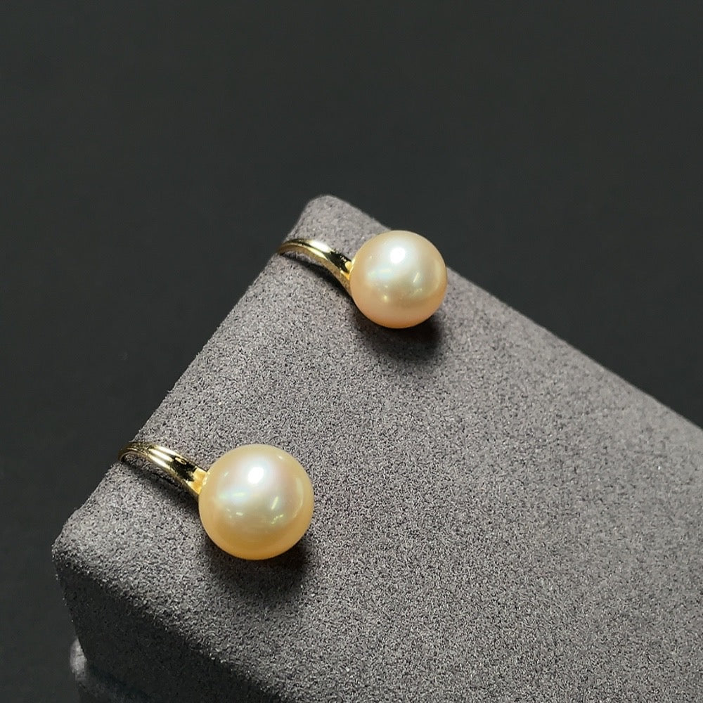 Saltwater pearl earrings with 18K gold settings, featuring elegant pearl drops and classic jewelry design by HKHQ.