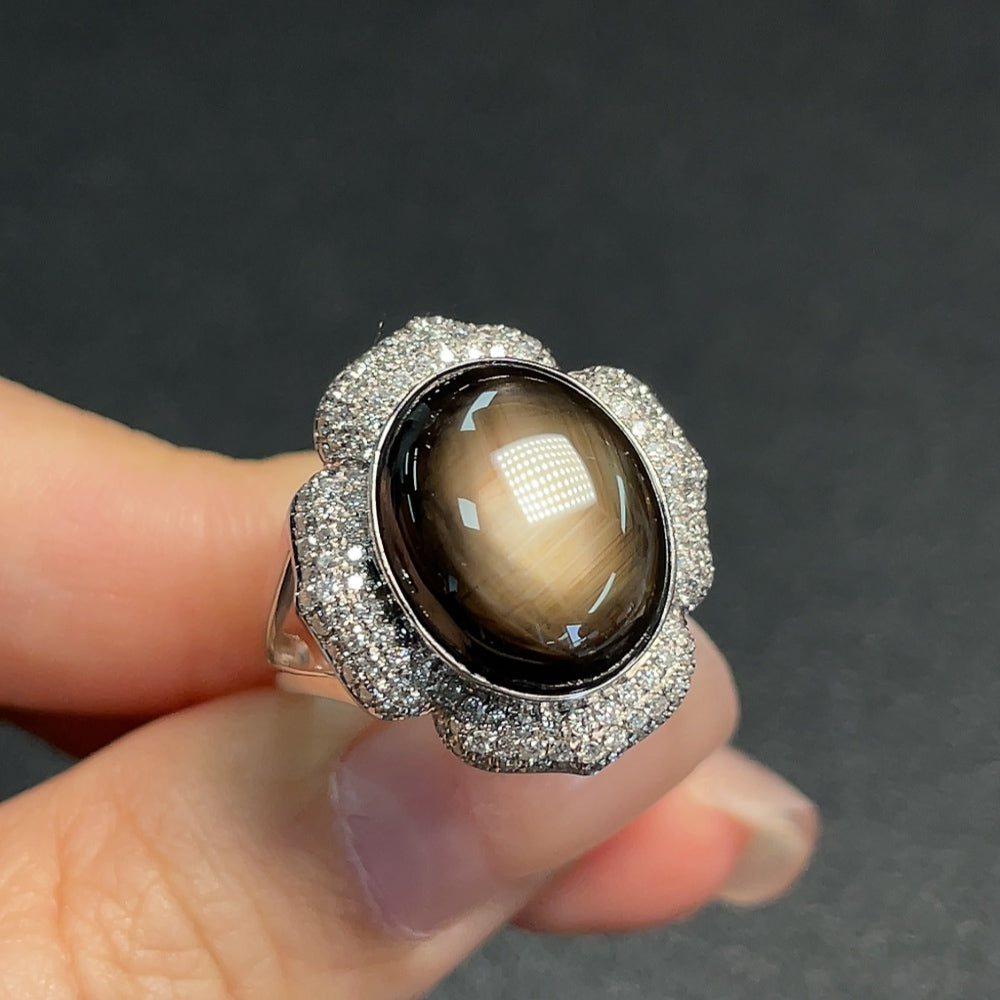 Huiliu Sapphire Ring with diamond accents showcasing a sparkling blue gemstone and delicate diamond details.
