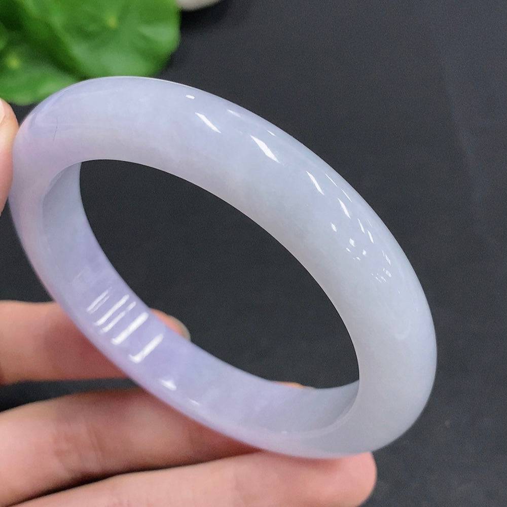 Jadeite round bracelet weighing approximately 61.5g with a size of 58, featuring smooth, polished green jade beads from HUILIU HQ.