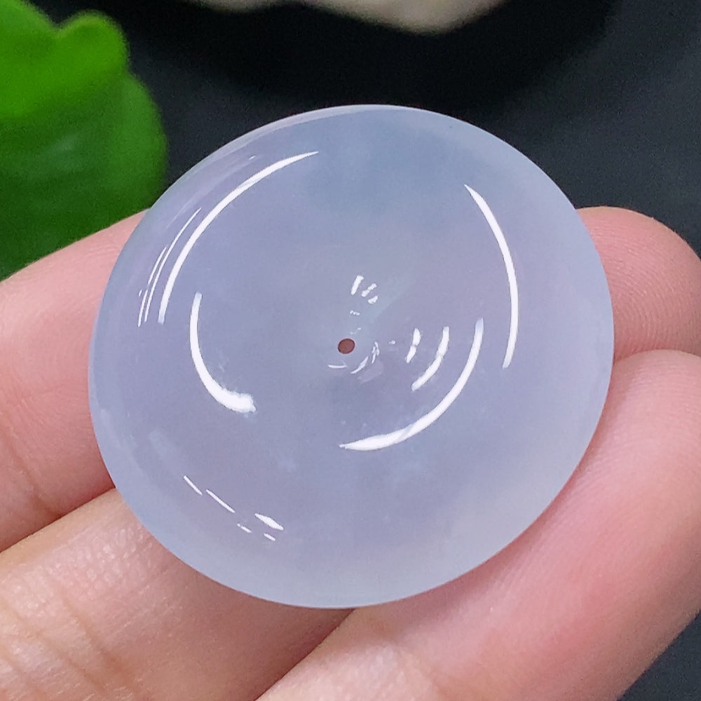 Jadeite pendant featuring a peace buckle design, crafted by HUILIU HQ, weighing approximately 9.37g, with a smooth green jade surface.