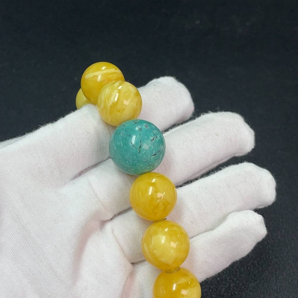Amber beeswax bracelet with non-natural accent stones, approximately 16.2mm in size, weighing about 40.13g, by HUILIU HQ.