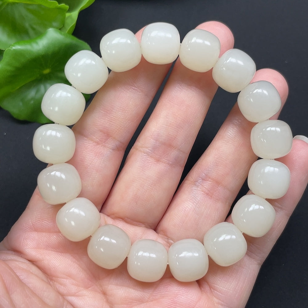 Hetian jade bracelet with 12mm beads and gold accents, weighing approximately 49.78g, crafted by HKHQ.