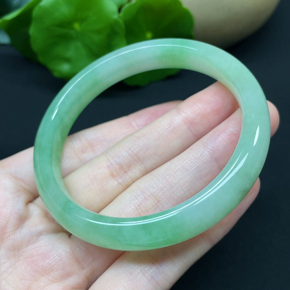 HKHQ jadeite round bangle in size 54.7, showcasing smooth, polished jadeite with a lightweight and elegant design.