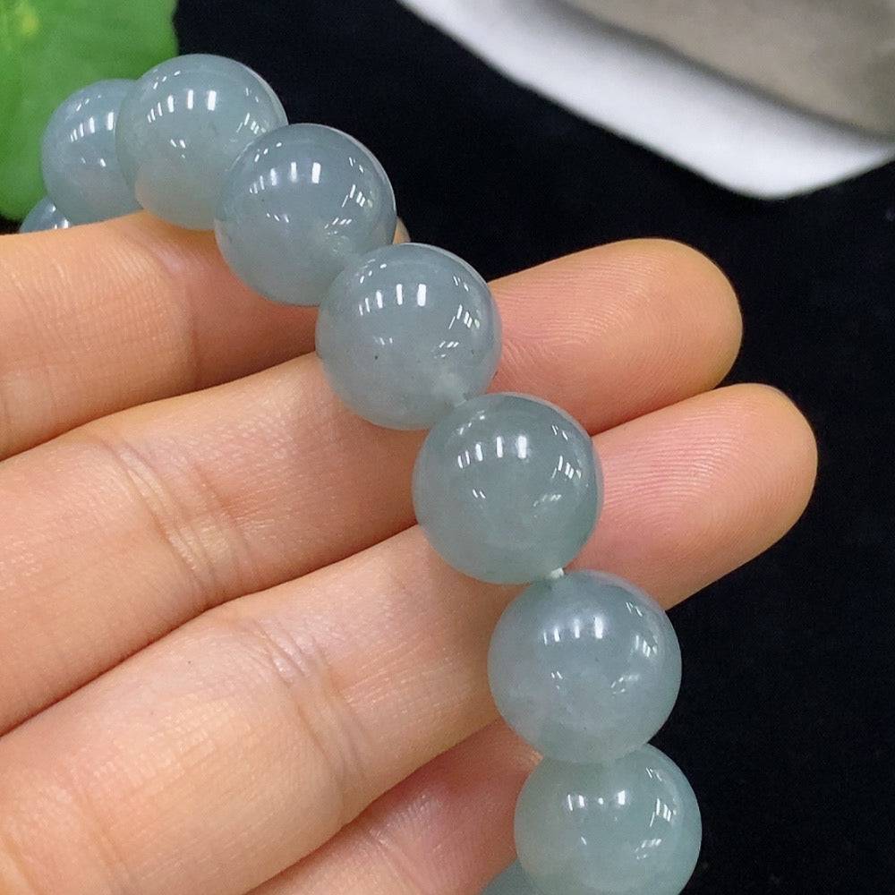 HUILIU HQ jadeite bracelet with 13mm beads, weighing approximately 58.13g, showcasing smooth green jade stones on a string.