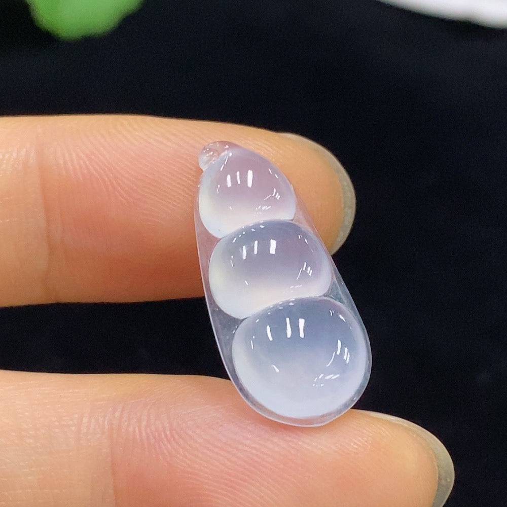 Jadeite Fu Dou inlaid piece with HUILIU HQ branding, weighing approximately 1.84g, showcasing intricate jade craftsmanship.