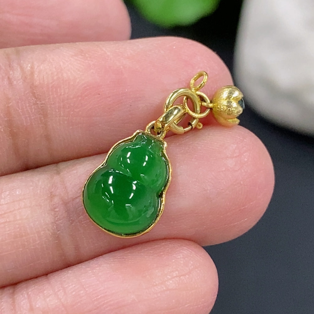 Jadeite gourd pendant necklace with 18K gold setting, showcasing a smooth green jadeite stone on a delicate chain.