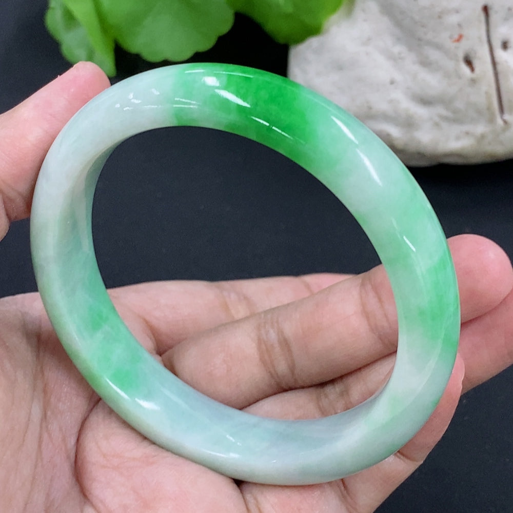 Jadeite round bracelet with a total weight of 54.97g and size 56.9, featuring smooth, polished jade stones from HKHQ.