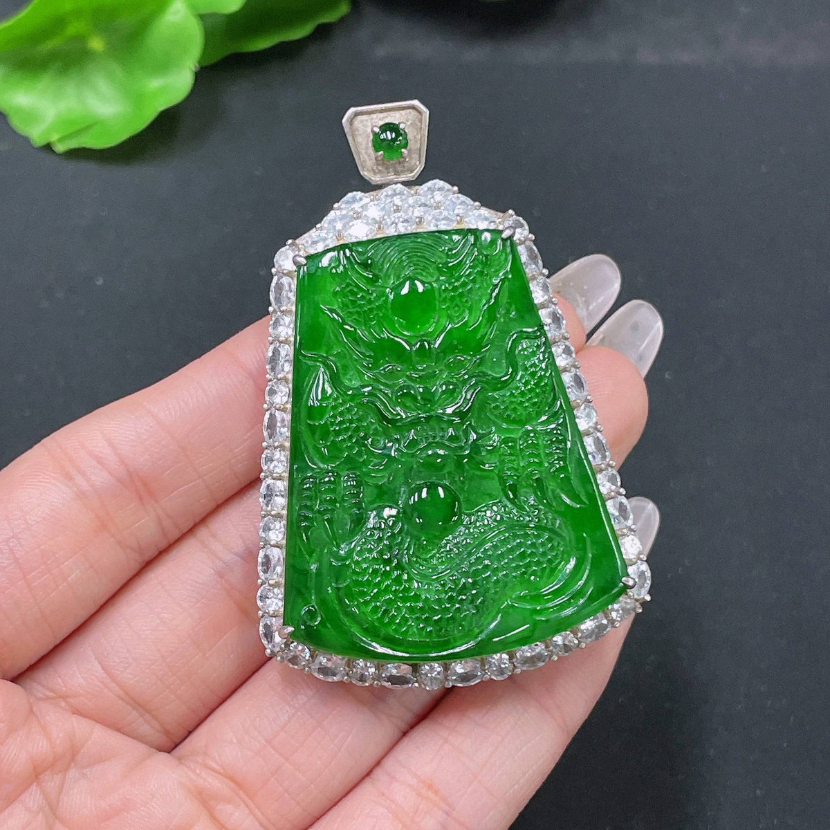 Jadeite pendant featuring a dragon plaque, non-gold, weighing approximately 26.55g, crafted by HUILIU HQ, with detailed jade carvings.