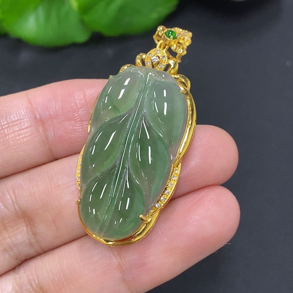 Jadeite leaf pendant with 18K gold and diamond accents, crafted by HKHQ, featuring a detailed jade jewelry design.