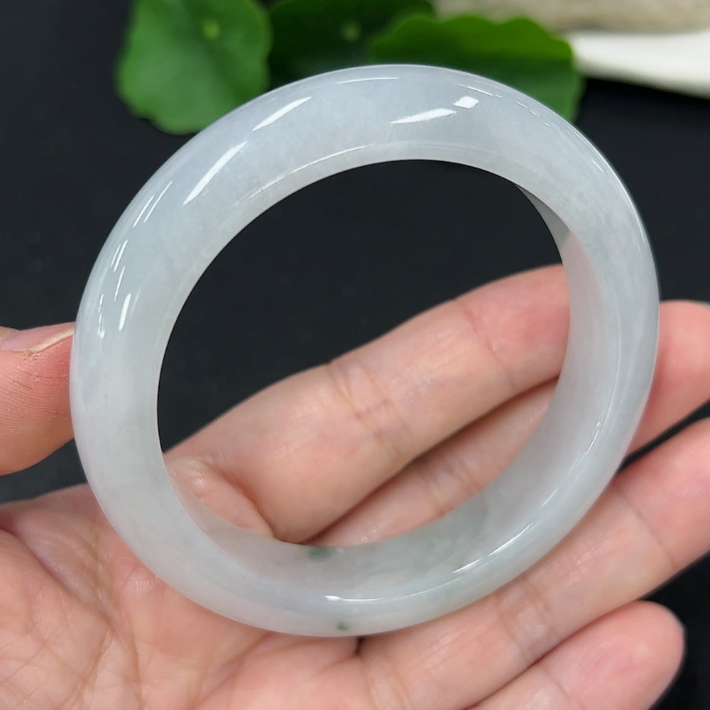 HKHQ jadeite round bangle, size 54.6, weighing approx. 59.5g, showcasing smooth, polished green jade jewelry.
